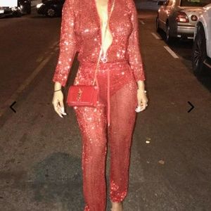 Red sheer jumpsuit fully sequined.